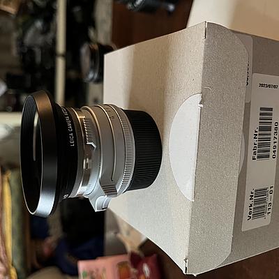 Looking to trade 35mm summilux steel rim reissue for a nikon s3 or SP black paint with 35mm 
